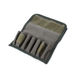 Close-up of a dark green tactical pouch with Velcro strap and multiple narrow pockets, showing durable fabric and stitching detail.