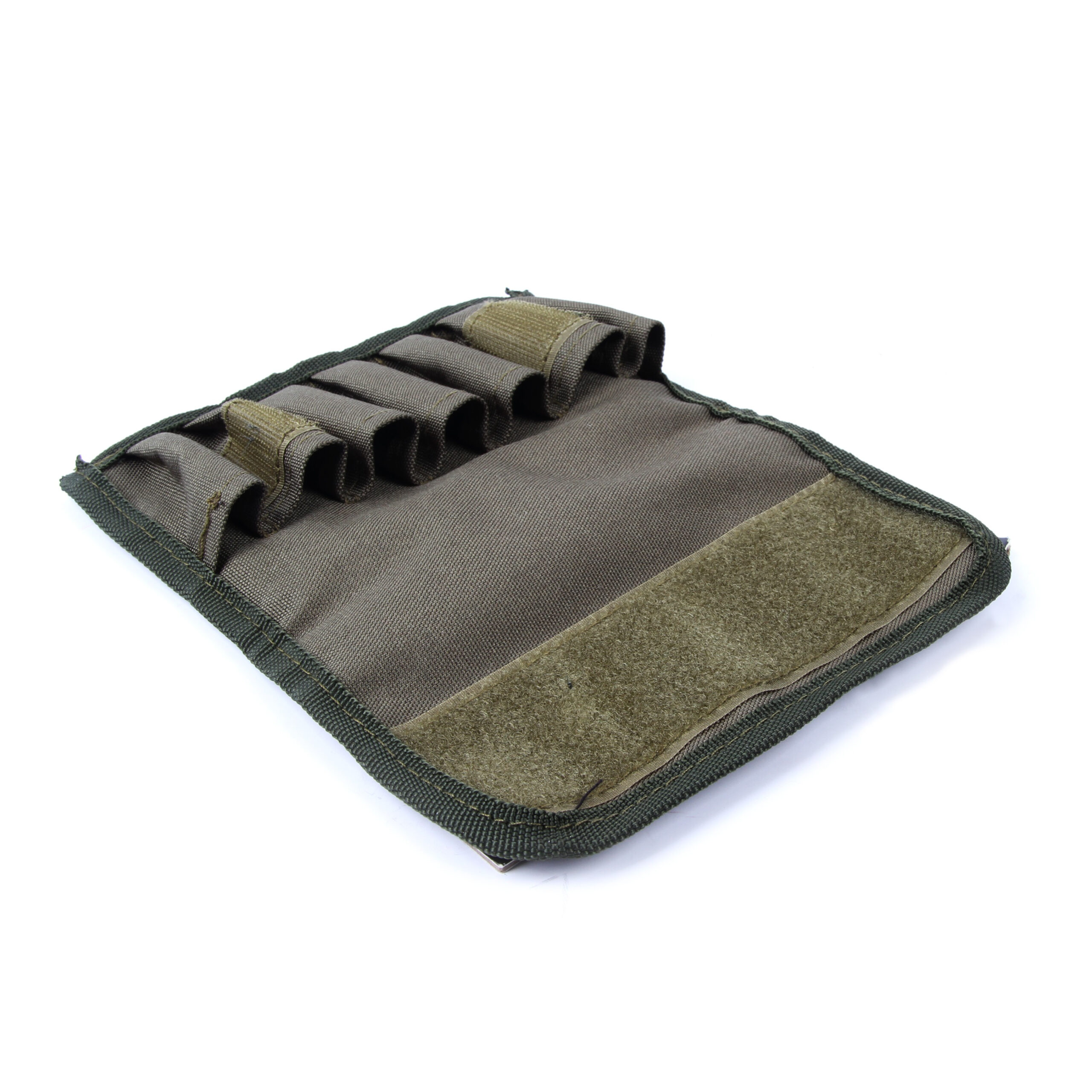 panostasku haulikolle | Suomen Erämetsästys Close-up of a brown tactical pouch showing MOLLE-style webbing and olive tabs on durable fabric.